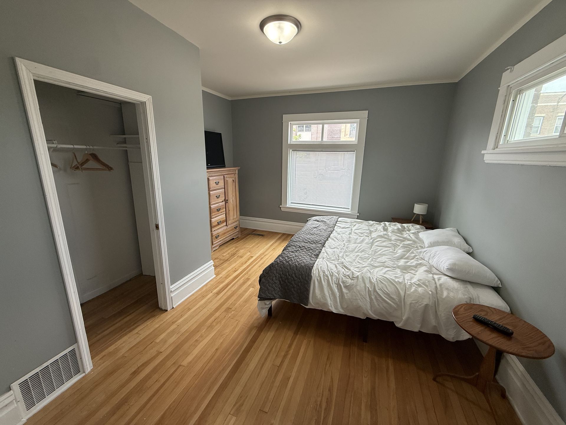 Bedroom with closet and dresser