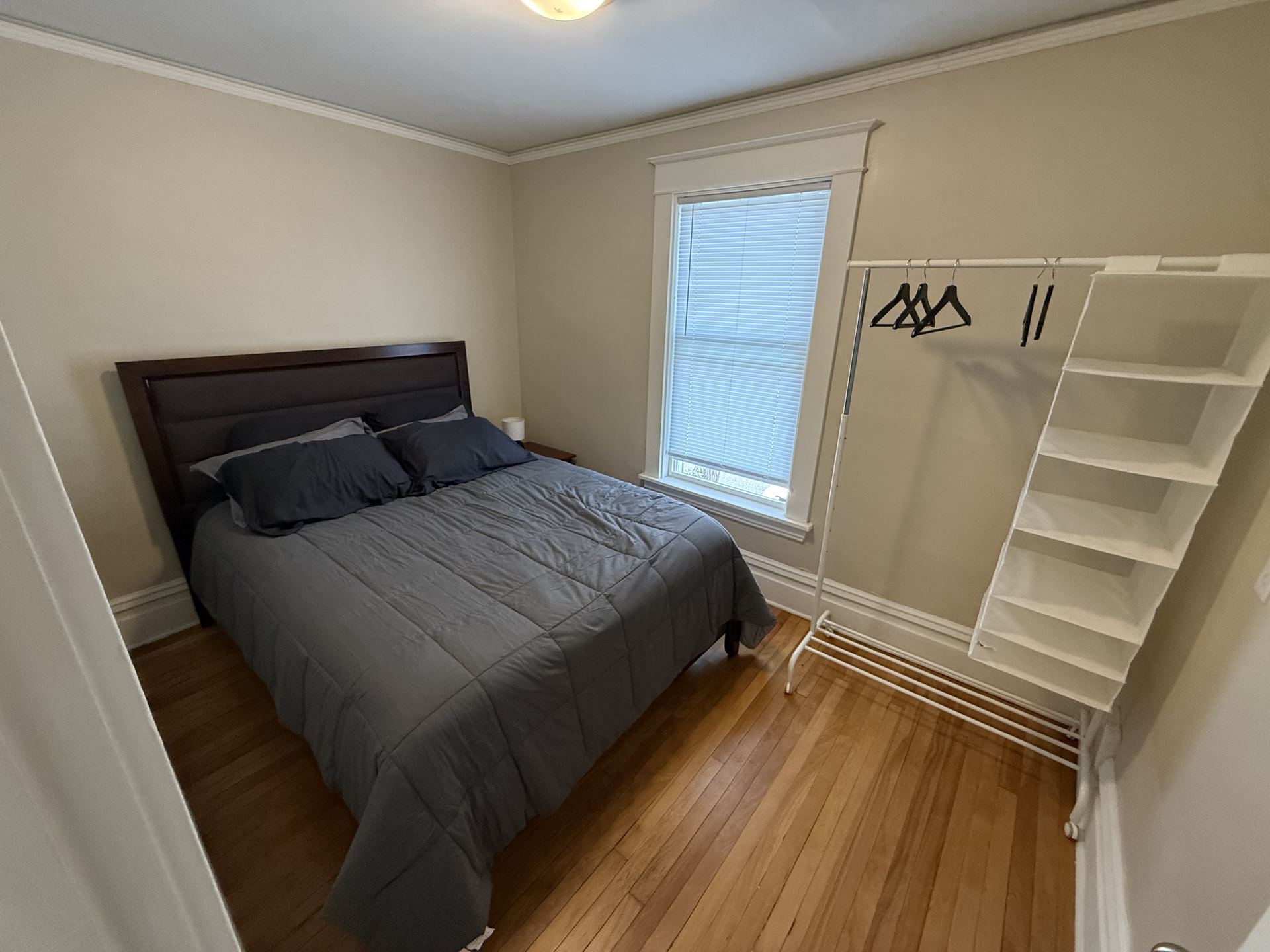 Bedroom with closet rack